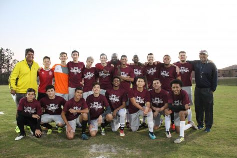 Posing for a team picture after the game, the Coyotes smiles are big from their huge win against Osceola Christian.
