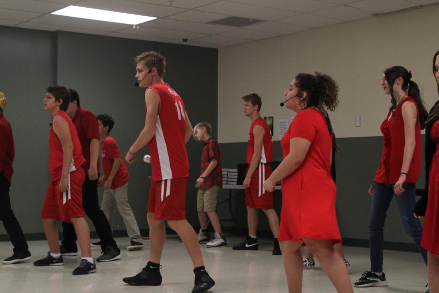 High School Musical Jr. cast performs the song Were All In This Together during the in-school preview of the show.