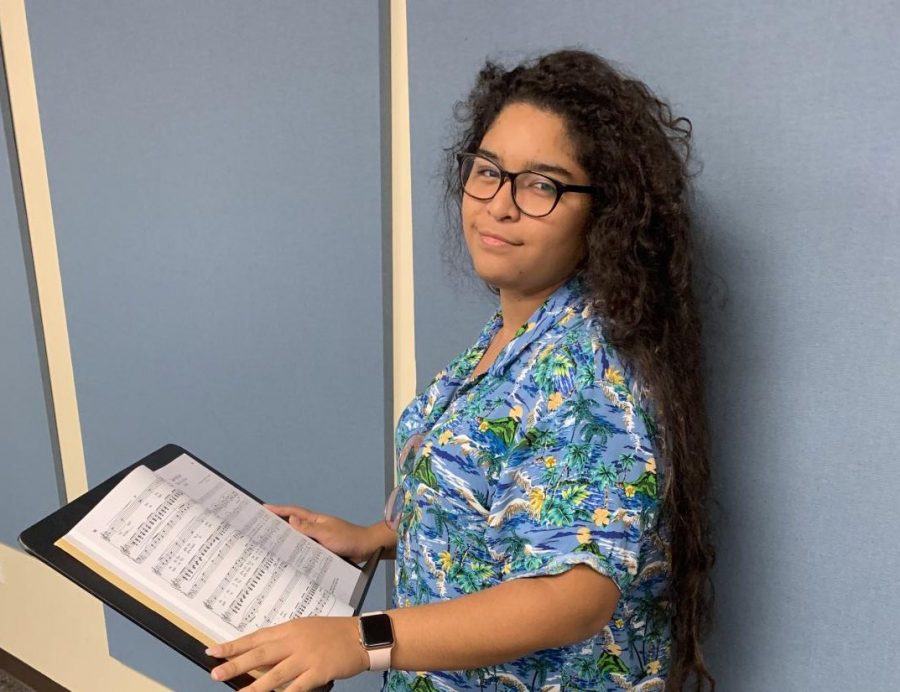 Senior, Alexandra Olivares practices her music. 