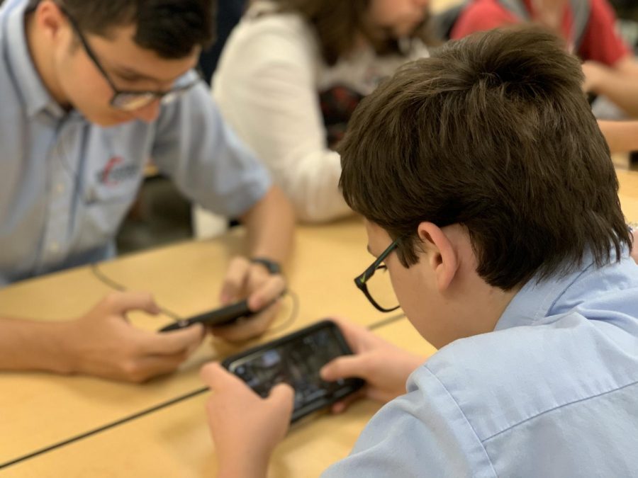 Senior, Tyler Powenski and junior, Ryan Taylor play COD Mobile during their lunch break