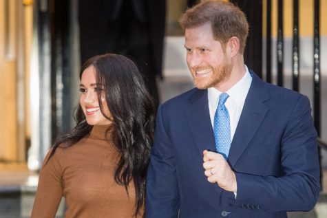 Harry Charles and Meghan Markle pose for photo. 