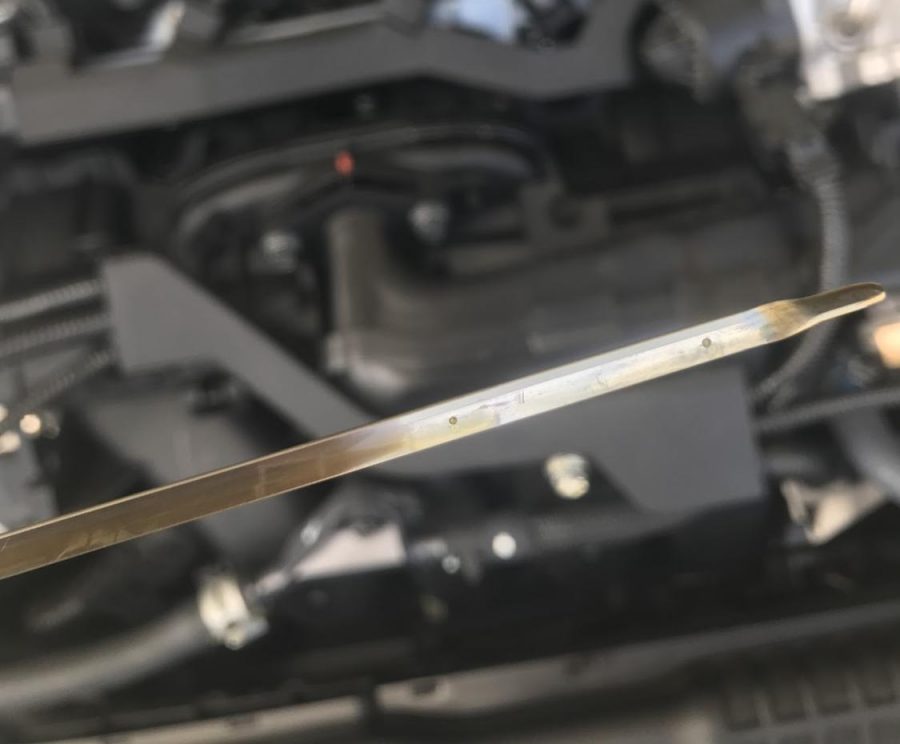 Dipstick to measure car oil level. 