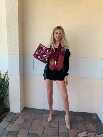 Jules with her decorated cap for graduation.