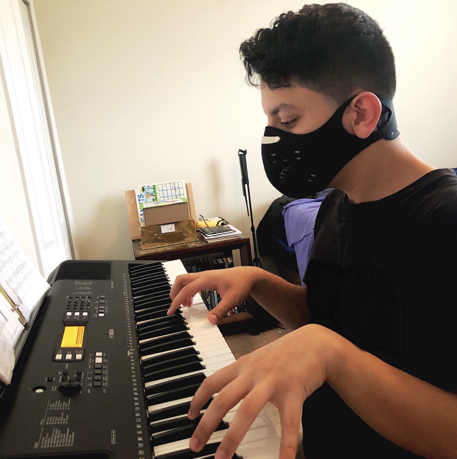 A&E Editor Patrick Deliz practices piano.