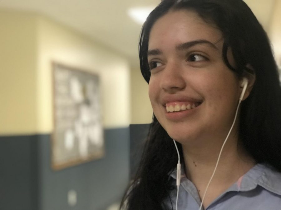 Senior Faith Nicholas listens to music.