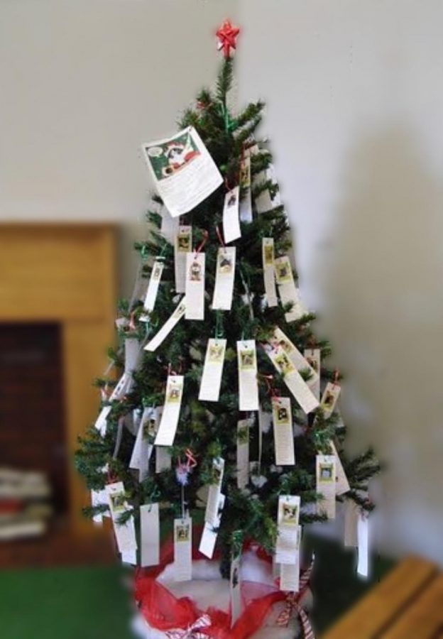 The angels on the tree by the front office each hold an item for a student at our school. 
Photo Credit: Creative Commons