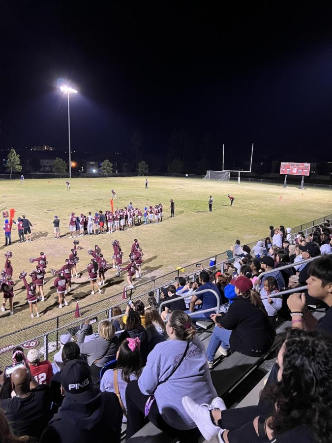 Fans watching a football game at Four Corners High School.