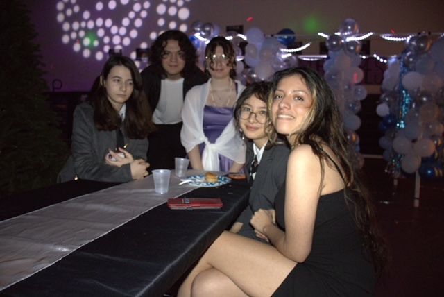 Senior Cynthia Valderrama and her friends attend the winter formal to dance and eat. 