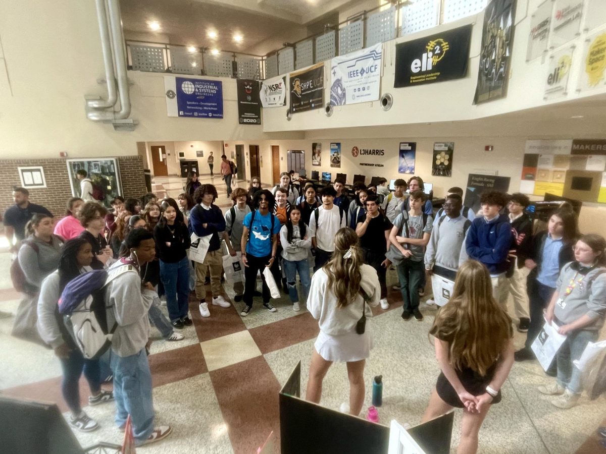 Four Corners students listen as tour guide gives instructions at UCF.
Credits 