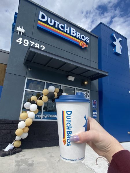 Kylie Fuller holds her coffee outside of the Dutch Bros Coffee stand.