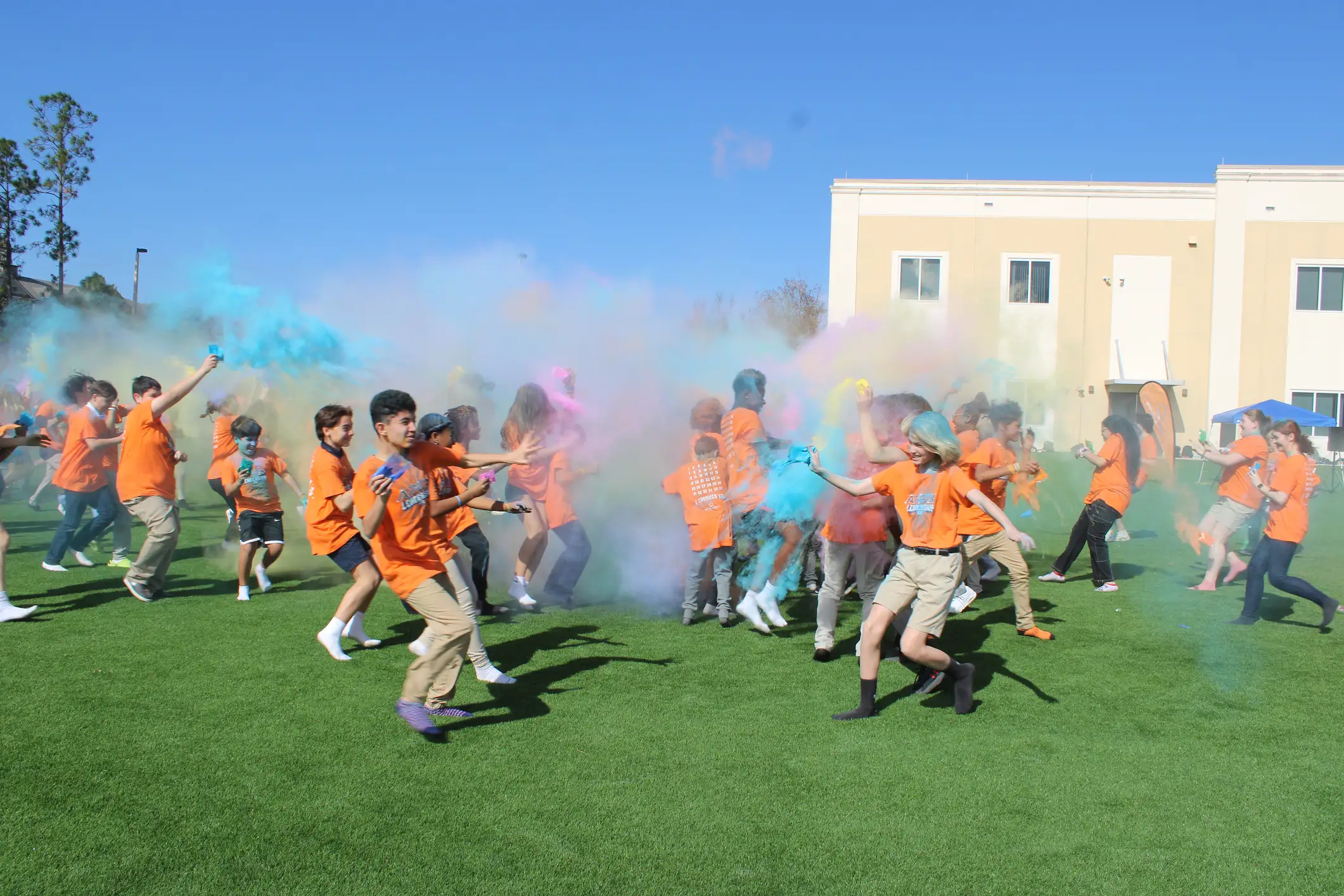 Participants throw colored powder at the opposing team.