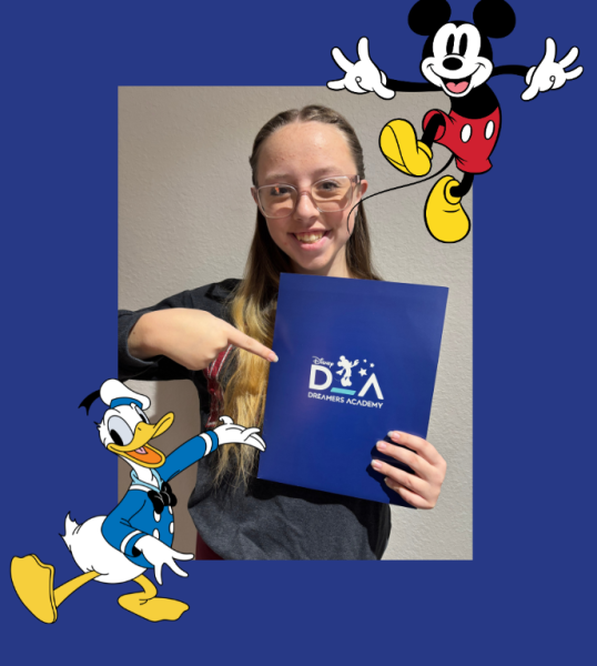 Junior Kylie Fuller holds up her Disney Dreamers Academy folder.