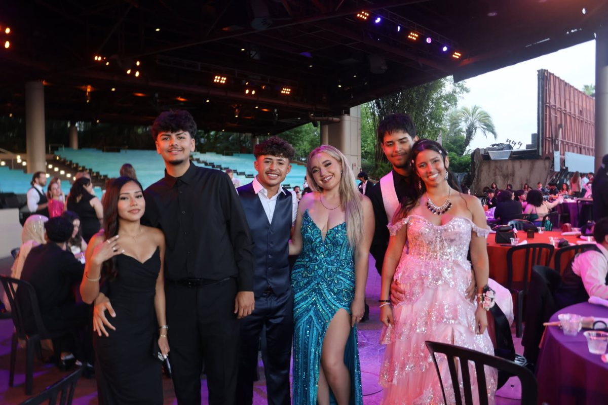 Prom partiers smile for a photo at this years prom. 
