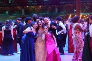 Students enjoying their time on the dance floor at prom. 