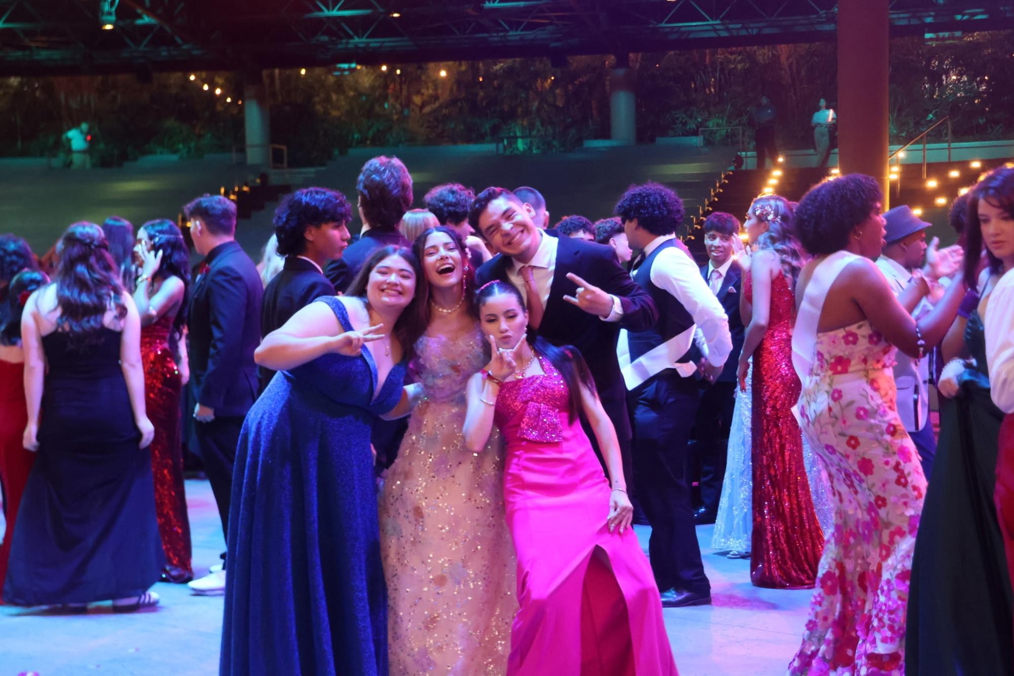 Students enjoying their time on the dance floor at prom. 