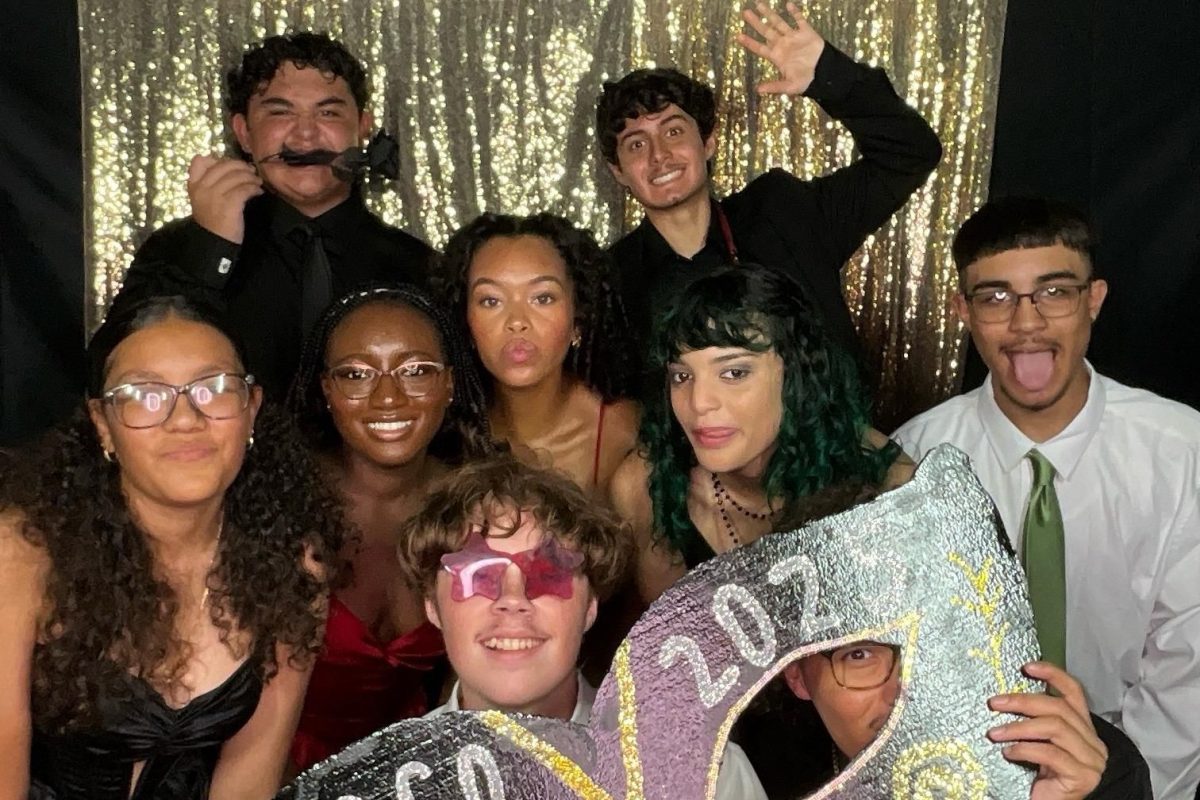 A group of people taking Photo Booth photos at Coco