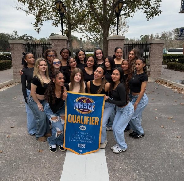 The Four Corners Upper School Cheer Team together for Nationals.